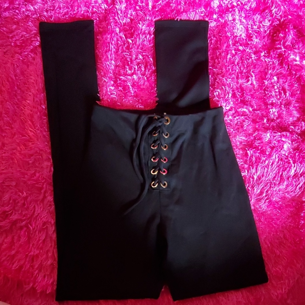 Black skinny polyester pants with lace up front